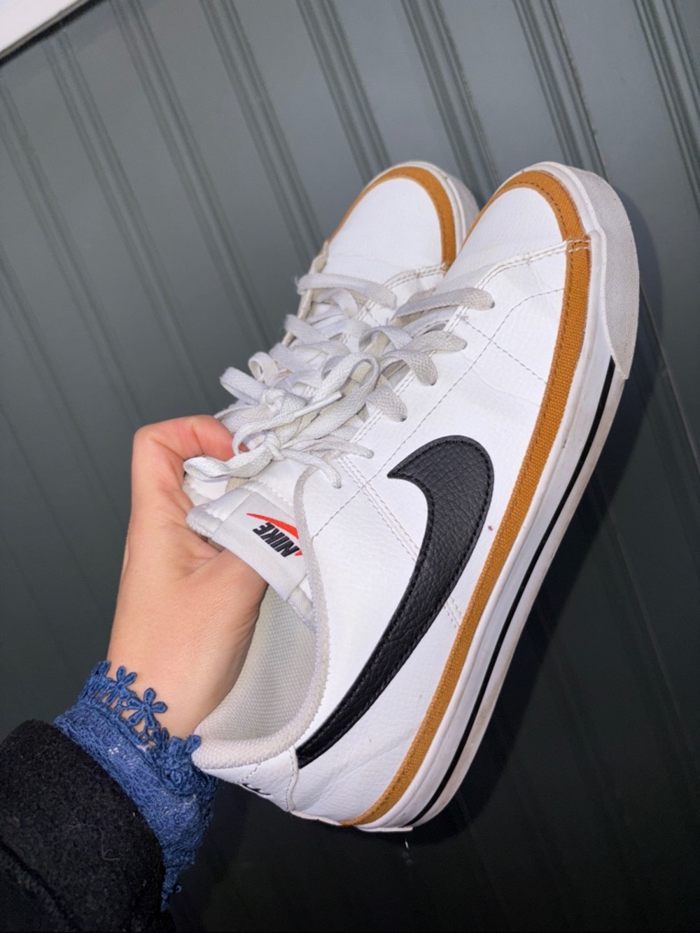 men’s Nike White Low-Top Sneakers with Black Swoosh and Brown Accent